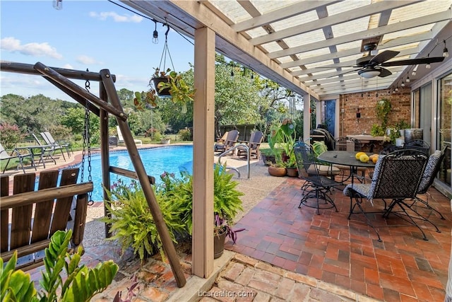 view of patio / terrace featuring a pergola and ceiling fan