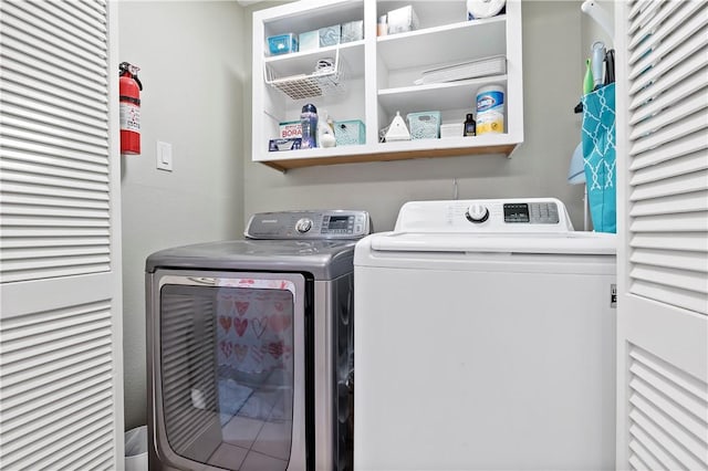 laundry area with laundry area and washing machine and clothes dryer