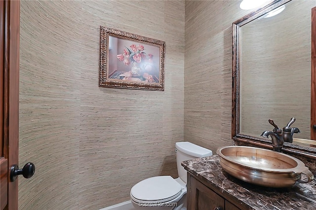 1650 Bird Pond Rd, College Station, TX 77845 - bathroom with toilet, vanity, and tile walls