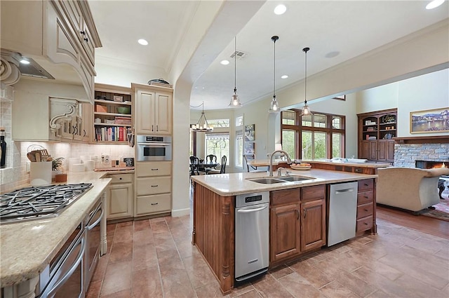 1650 Bird Pond Rd, College Station, TX 77845 - kitchen with a stone fireplace, a sink, crown molding, stainless steel appliances, and open floor plan