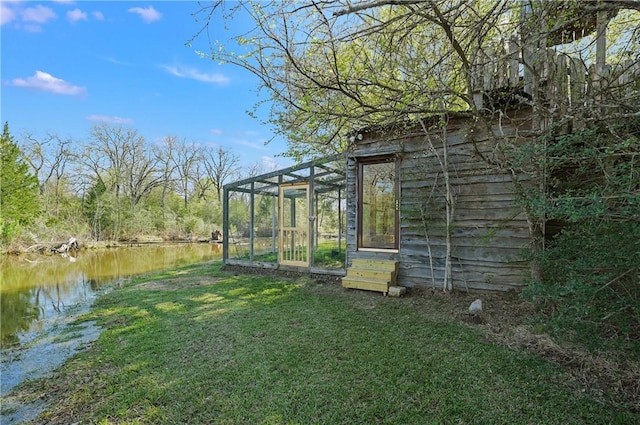 1650 Bird Pond Rd, College Station, TX 77845 - view of green lawn featuring a water view