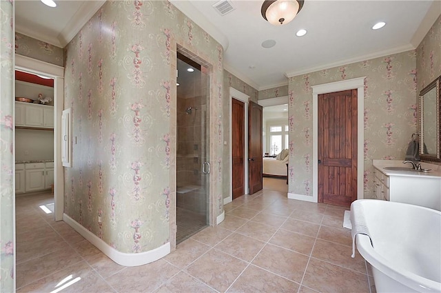 1650 Bird Pond Rd, College Station, TX 77845 - bathroom featuring a stall shower, crown molding, a soaking tub, tile patterned floors, and baseboards