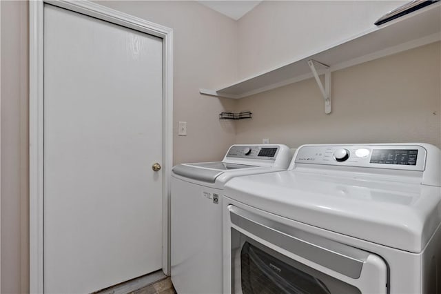 laundry area with laundry area and independent washer and dryer