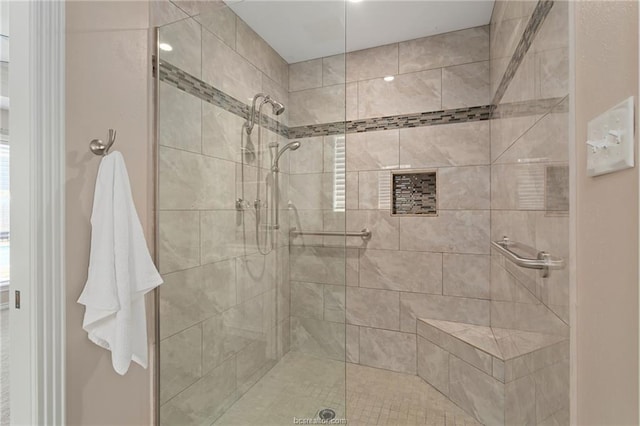 bathroom with tiled shower