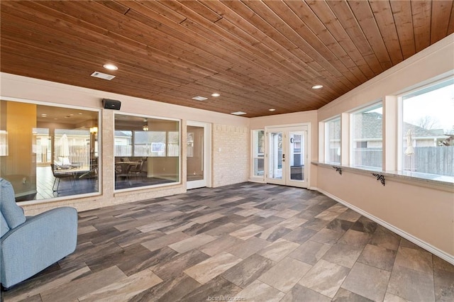 unfurnished sunroom with french doors and wooden ceiling