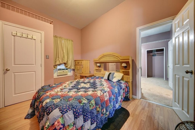 bedroom with a closet and light hardwood / wood-style floors