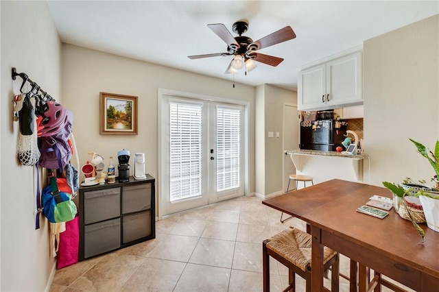 dining room with light tile patterned floors, french doors, baseboards, and a ceiling fan