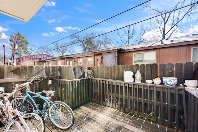 exterior space with a wooden deck and fence