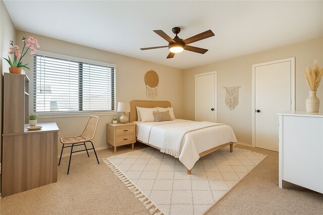 4513 Carter Creek Pkwy Unit 7, Bryan, TX 77802 - bedroom with light colored carpet, baseboards, and ceiling fan
