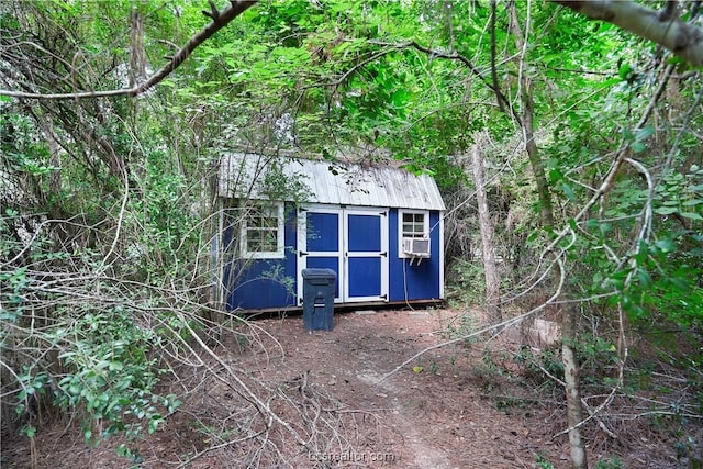 view of outbuilding with cooling unit