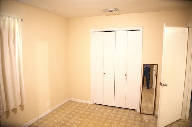 unfurnished bedroom with a closet