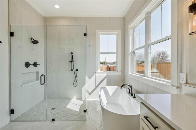 bathroom featuring a soaking tub, tile patterned flooring, a shower stall, and ornamental molding