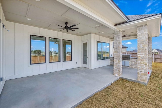 view of patio featuring fence, a ceiling fan, and area for grilling