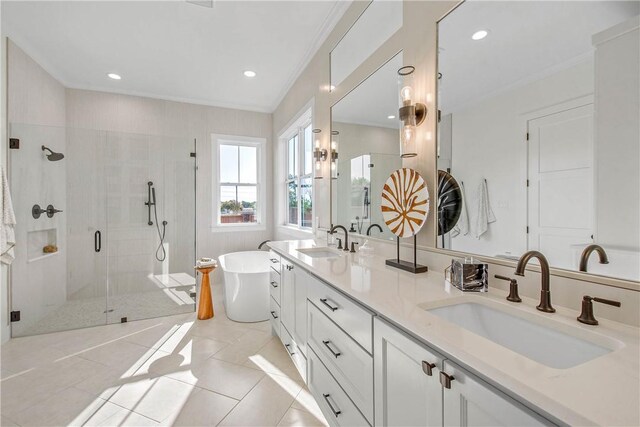 full bathroom featuring crown molding, a soaking tub, a sink, and a stall shower