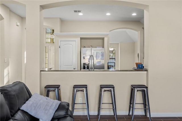 bar with stainless steel fridge