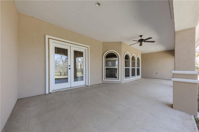 view of patio with a ceiling fan and french doors