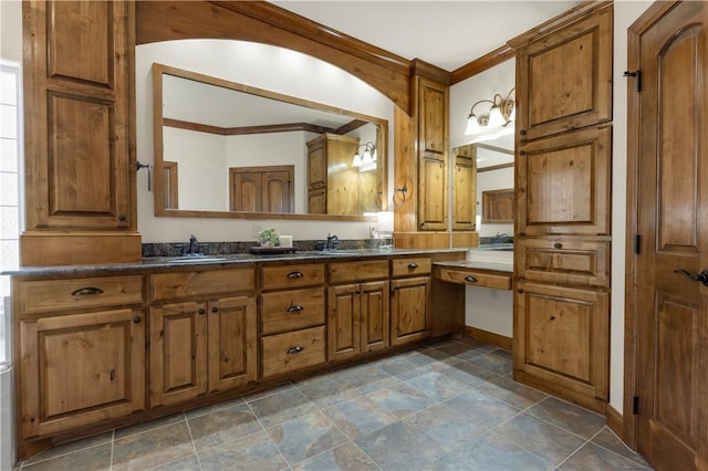 full bathroom featuring a sink, crown molding, and double vanity