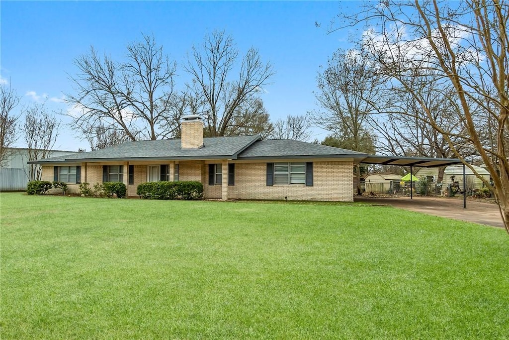 single story home with a carport and a front lawn