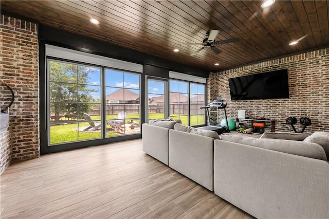 4813 Coopers Hawk Dr, College Station, TX 77845 - living area with brick wall, wood finished floors, wood ceiling, ceiling fan, and recessed lighting