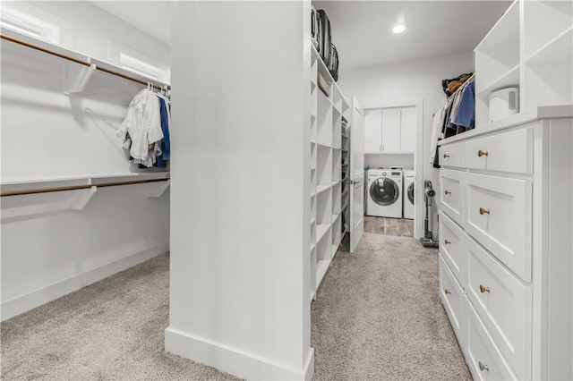 4813 Coopers Hawk Dr, College Station, TX 77845 - walk in closet featuring washer and dryer and light carpet