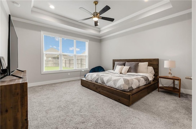 4813 Coopers Hawk Dr, College Station, TX 77845 - carpeted bedroom with a raised ceiling, crown molding, baseboards, and ceiling fan