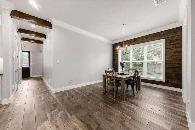 4813 Coopers Hawk Dr, College Station, TX 77845 - dining room with a chandelier, dark wood-type flooring, and baseboards