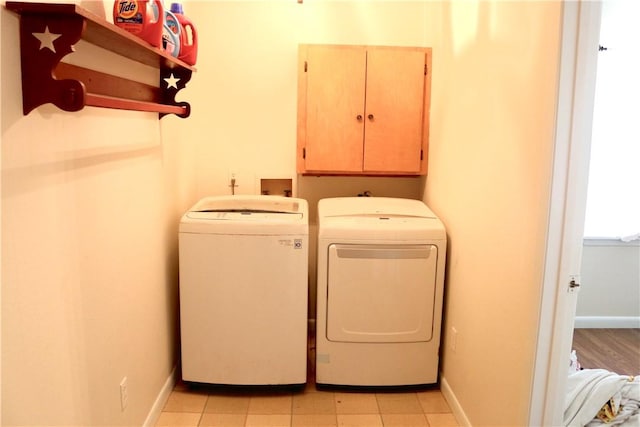 106 N Minden St, Madisonville, TX 77864 - washroom with cabinet space and separate washer and dryer