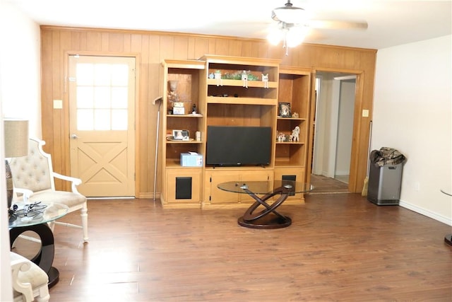 106 N Minden St, Madisonville, TX 77864 - sitting room with wooden walls and wood finished floors