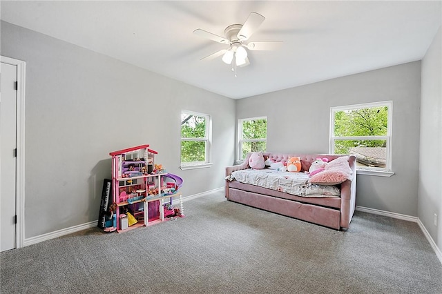 bedroom with ceiling fan and carpet floors