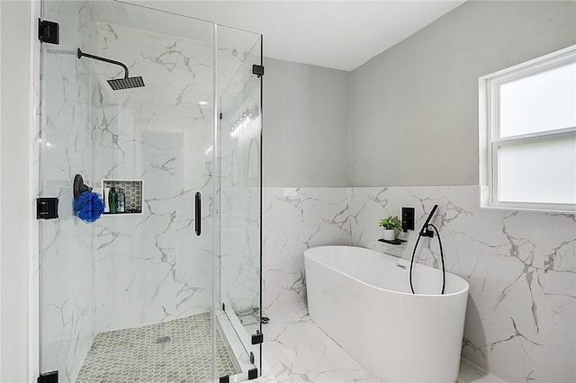 bathroom featuring independent shower and bath and tile walls