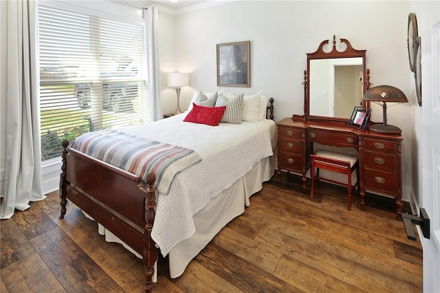 bedroom featuring dark hardwood / wood-style flooring and crown molding