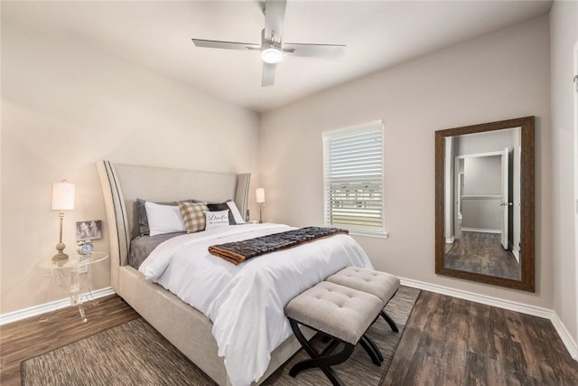 bedroom with dark hardwood / wood-style floors and ceiling fan