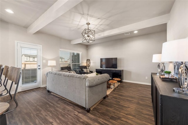 living room with dark wood-type flooring, an inviting chandelier, and beam ceiling