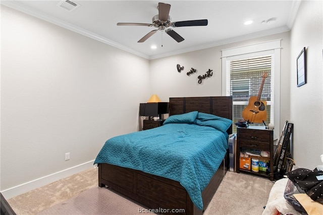 carpeted bedroom with ceiling fan and ornamental molding