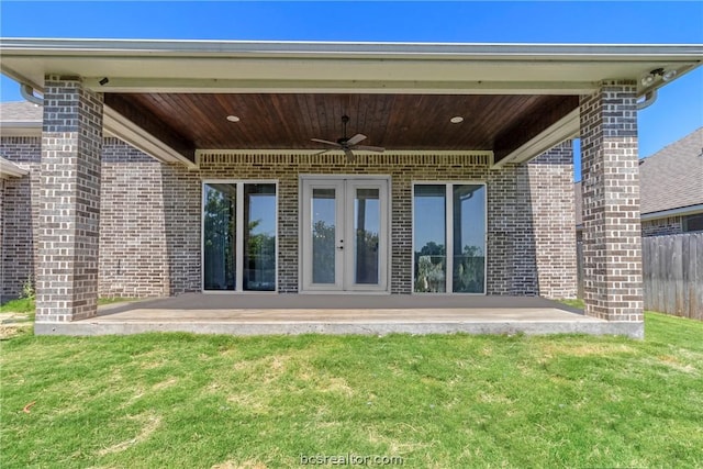 exterior space with french doors, a yard, a patio, and ceiling fan