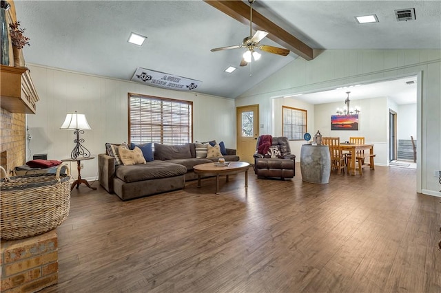 living room featuring ceiling fan with notable chandelier, lofted ceiling with beams, dark hardwood / wood-style floors, and a brick fireplace