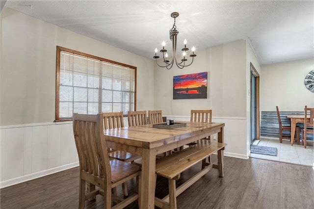 dining room with a notable chandelier and dark hardwood / wood-style floors