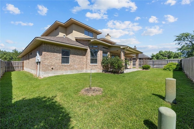 4412 Hearst Ct, College Station, TX 77845 - back of house featuring brick siding and a chimney