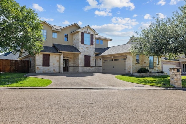 4412 Hearst Ct, College Station, TX 77845 - view of front of property with stone siding, driveway, a garage, and a shingled roof
