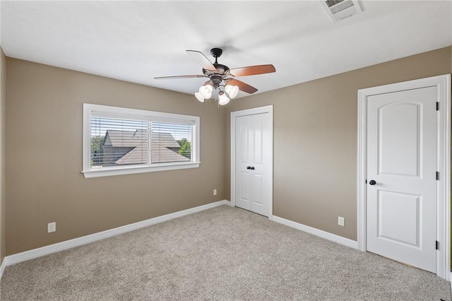 4412 Hearst Ct, College Station, TX 77845 - unfurnished bedroom with light colored carpet, a closet, baseboards, and ceiling fan