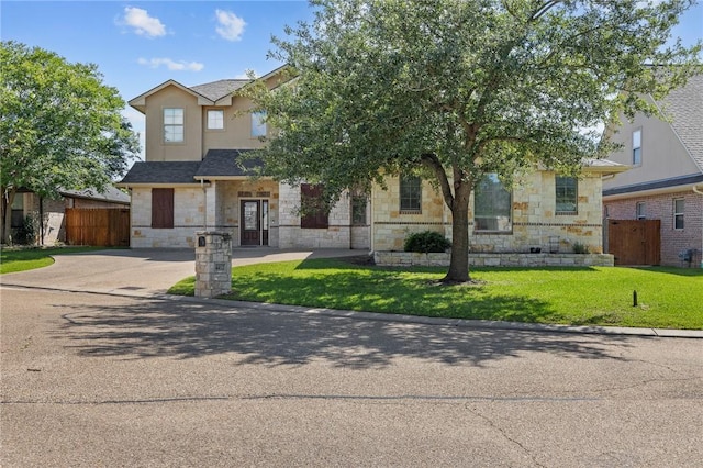4412 Hearst Ct, College Station, TX 77845 - view of property hidden behind natural elements featuring stone siding and driveway