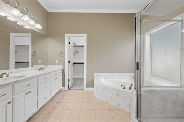 4412 Hearst Ct, College Station, TX 77845 - full bathroom featuring a bath, a shower stall, ornamental molding, double vanity, and a spacious closet