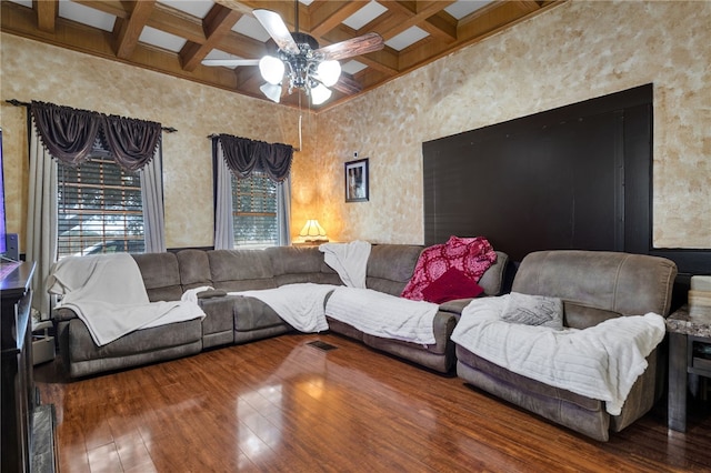 living room featuring beamed ceiling, wood-type flooring, and coffered ceiling