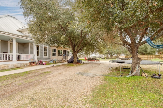 exterior space with a porch and a trampoline