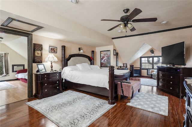 bedroom with wood-type flooring, lofted ceiling, and ceiling fan