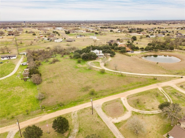 bird's eye view featuring a rural view and a water view