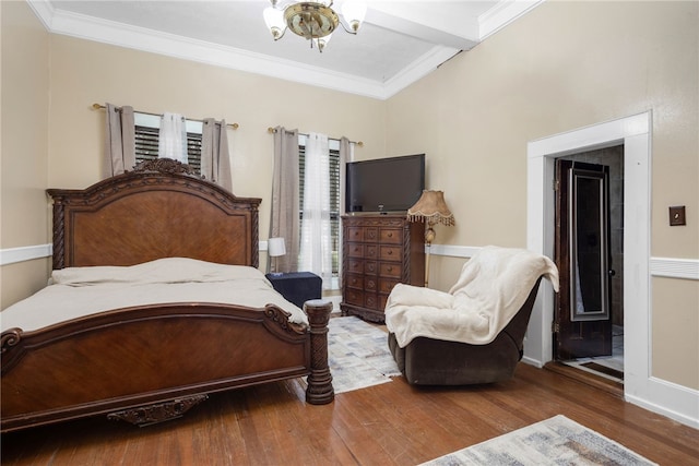 bedroom featuring hardwood / wood-style floors and crown molding