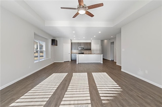 5769 Paseo Pl, Bryan, TX 77807 - unfurnished living room with ceiling fan, dark wood-type flooring, and recessed lighting