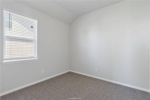 5769 Paseo Pl, Bryan, TX 77807 - carpeted empty room featuring lofted ceiling and healthy amount of natural light