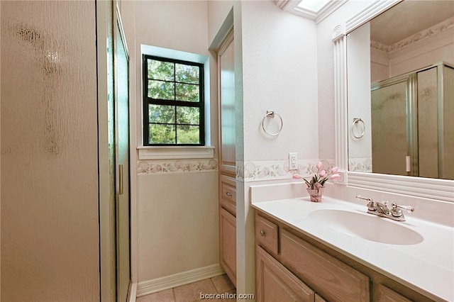 bathroom featuring tile patterned floors, vanity, and an enclosed shower